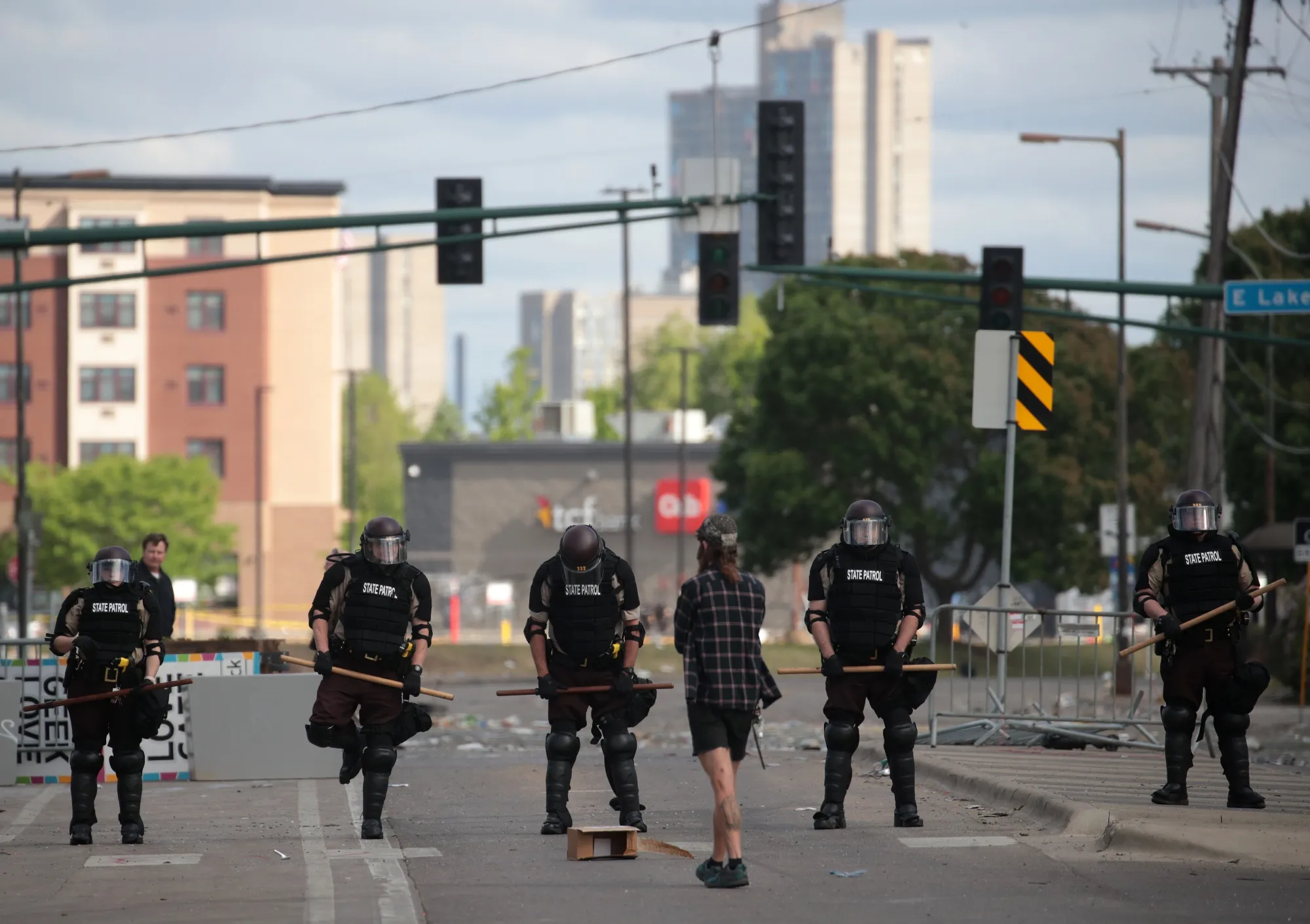 A person approaches a police line after a night of protests in Minneapolis, Minnesota, on May 29, 2020.