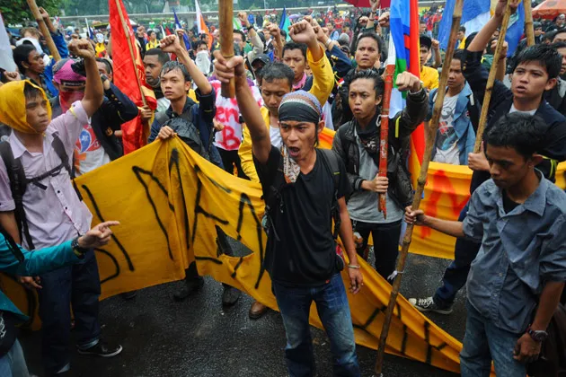 Protesters outside Indonesia’s parliament during a demonstration against plans to raise fuel prices in Jakarta on June 17