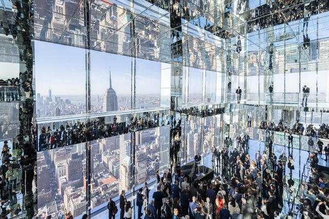 Attendees during the grand opening of the Summit One Vanderbilt observation deck in New York, U.S., on Thursday, Oct. 21, 2021. The attraction takes visitors to the 93rd floor, high above iconic skyscrapers like the Empire State Building and the Chrysler Building, and features an immersive art installation called "Air," created by artist Kenzo Digital. 