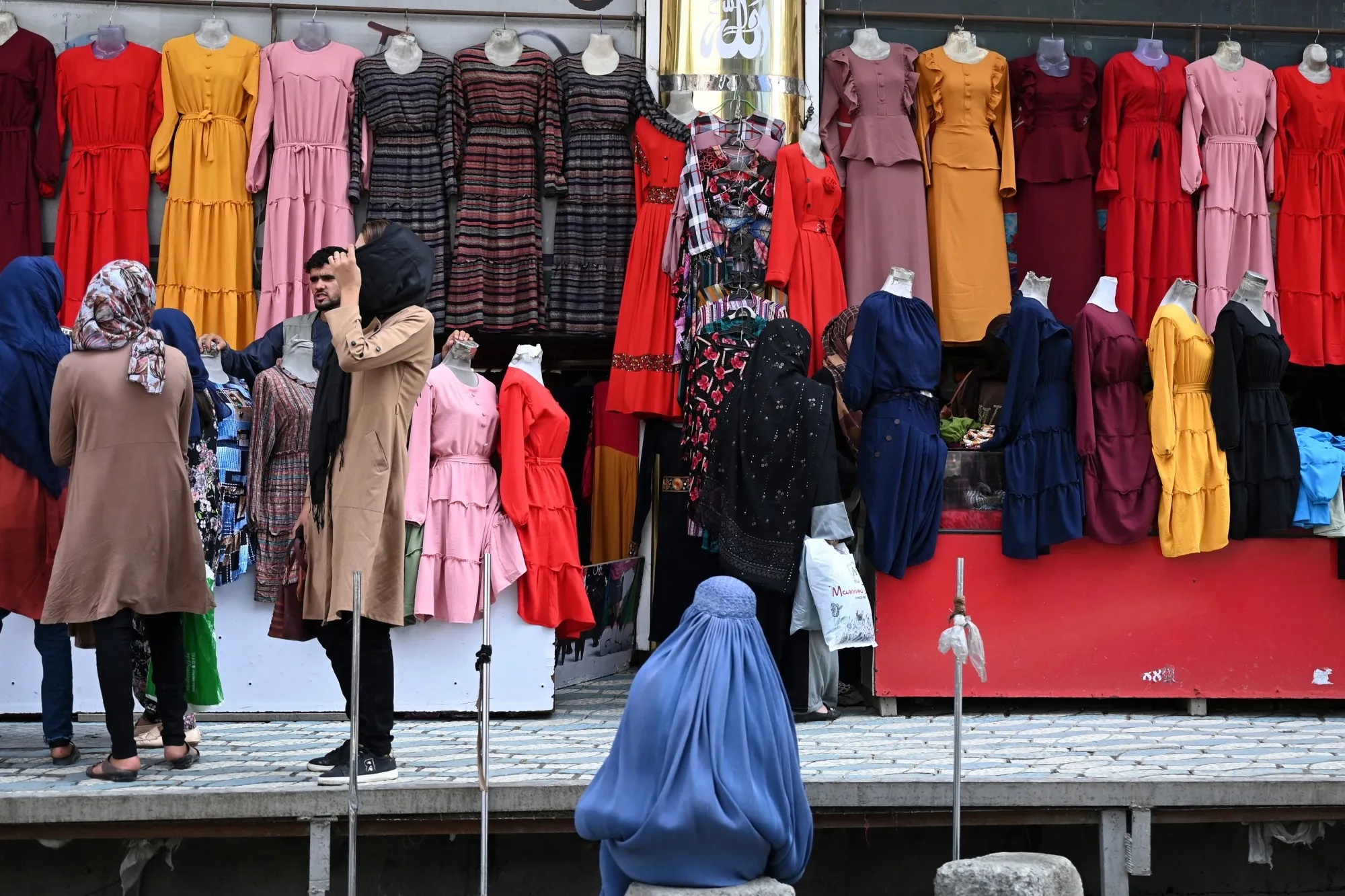 Shoppers in Kabul before the city fell to the Taliban..