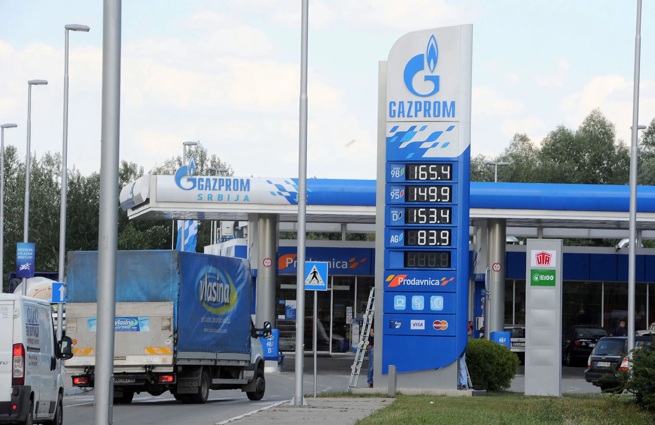 Gasoline prices sit on display outside a fuel station operated by OAO Gazprom Neft in Belgrade, Serbia, on June 5, 2014.

