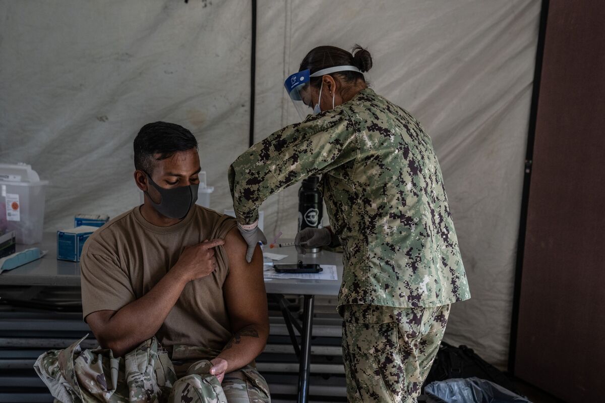 Military's Covid Vaccine Mandate Scrapped With Biden's Defense Bill Signing  - Bloomberg