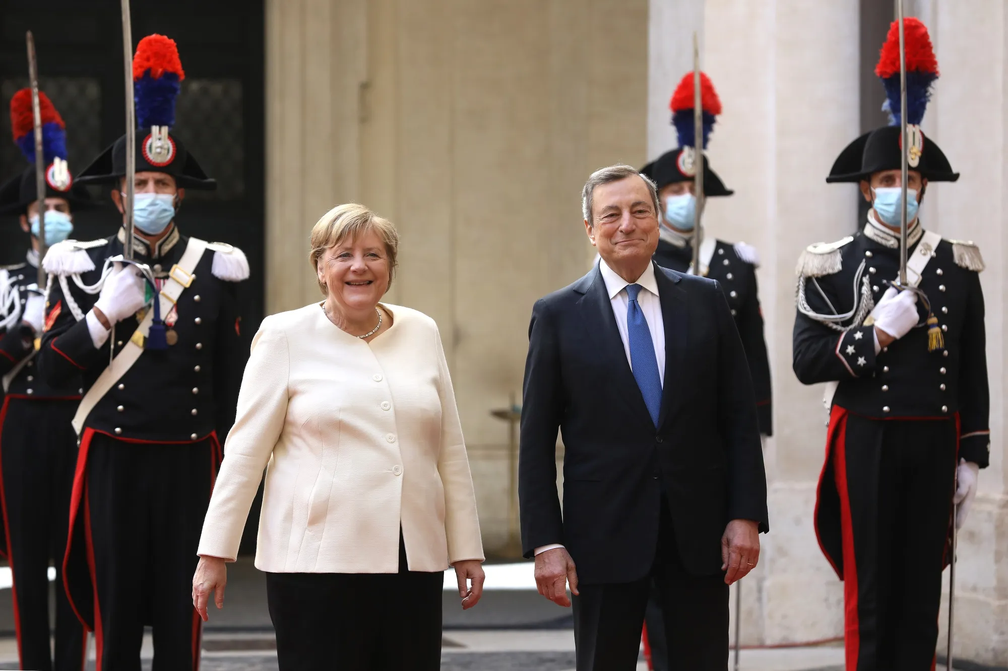 Mario Draghi and Angela Merkel ahead of their meeting in Romeon Oct. 7.