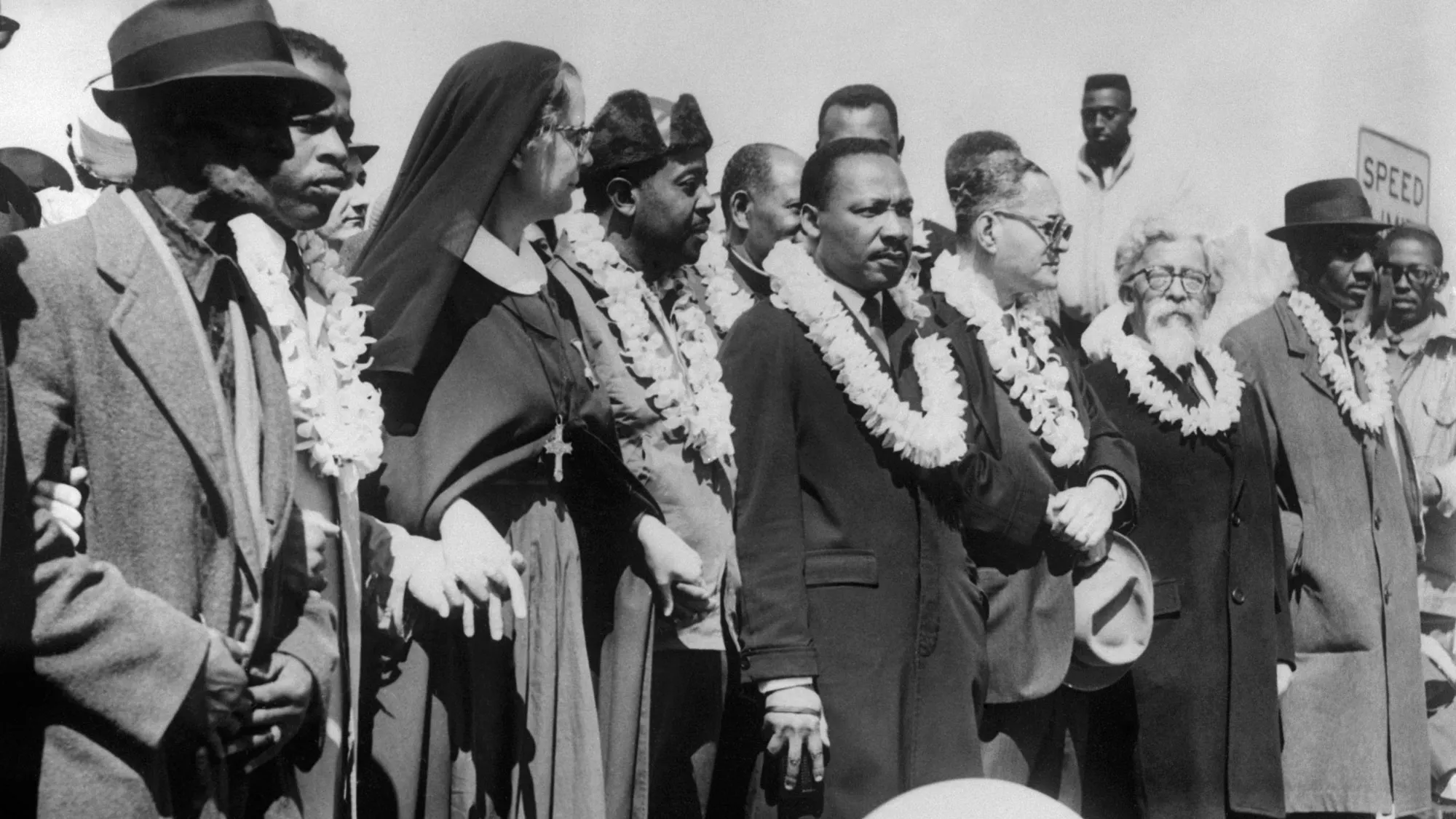 Civil rights demonstrators, led by Dr Martin Luther King (5th R), civil rights activist Ralph Abernathy (5th L), John Lewis (3rd L) and other civil and religious leaders, make their way from Selma to Montgomery on March 22, 1965 in Alabama, on the third leg of the Selma to Montgomery marches.
