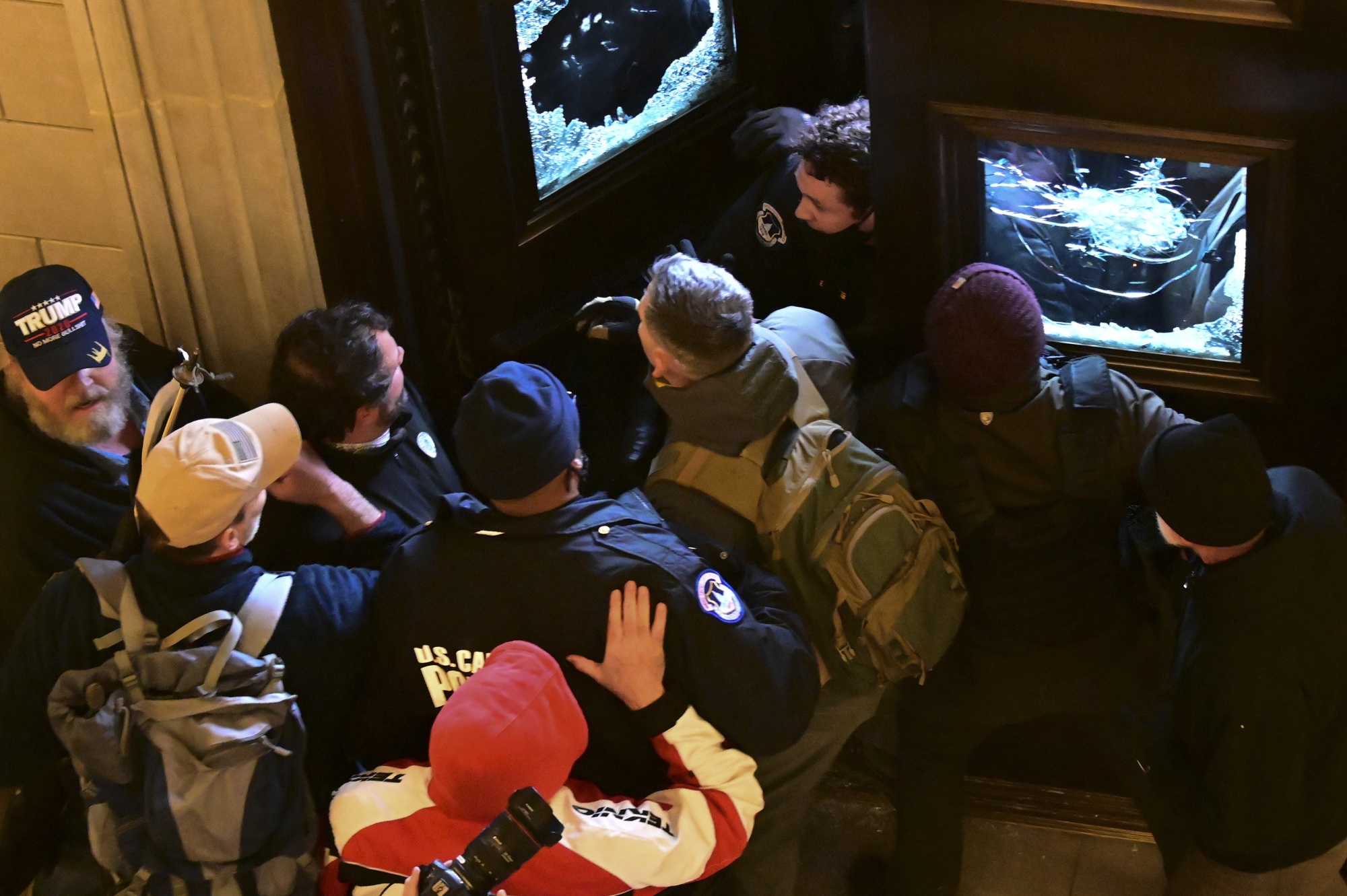 Demonstrators breach a door of the U.S. Capitol as a joint session of Congress to count the votes of the 2020 presidential election takes place in Washington, D.C., U.S., on Jan. 6.