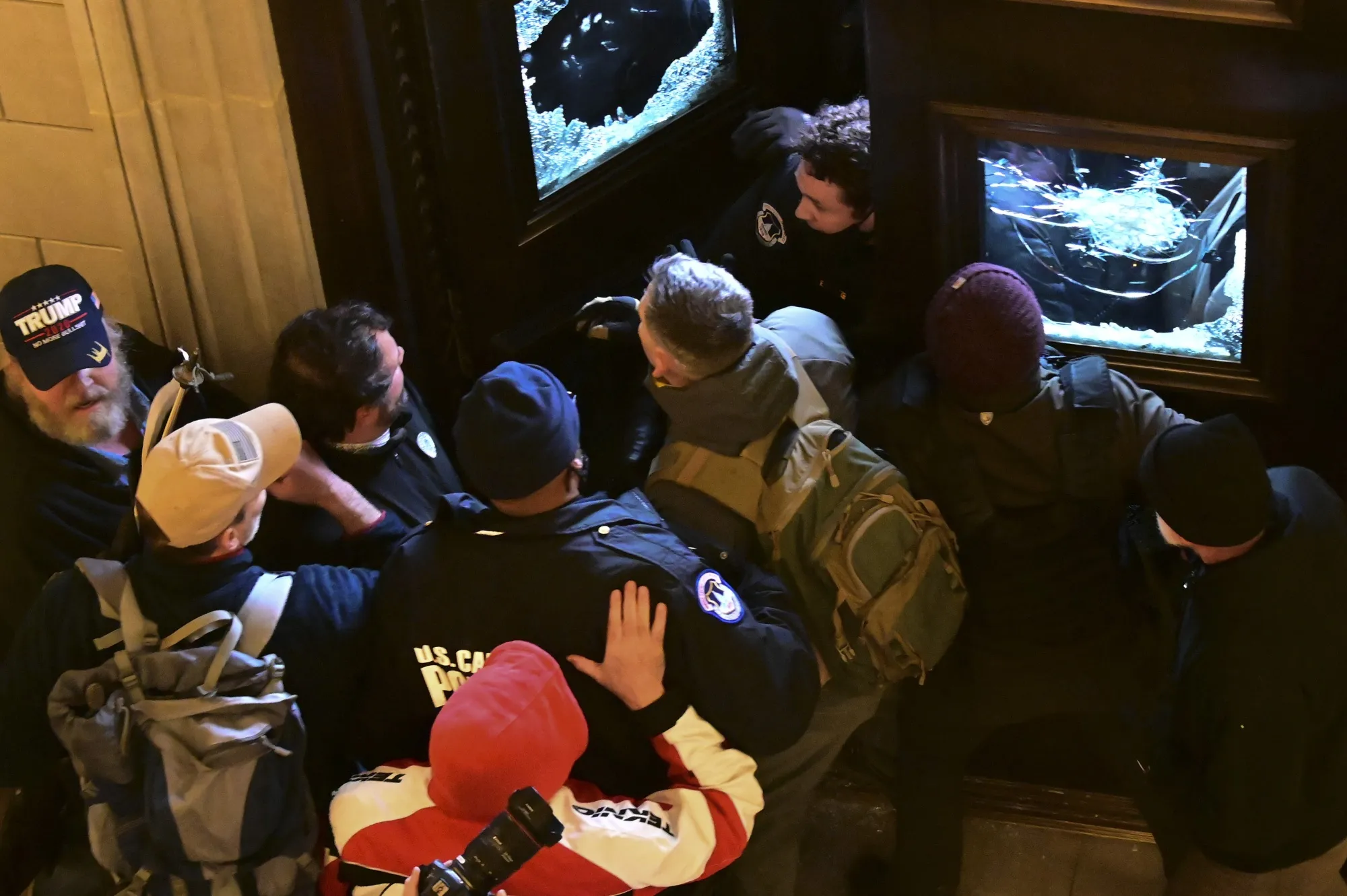 Demonstrators breach a door of the U.S. Capitol as a joint session of Congress to count the votes of the 2020 presidential election takes place in Washington, D.C., U.S., on Jan. 6.