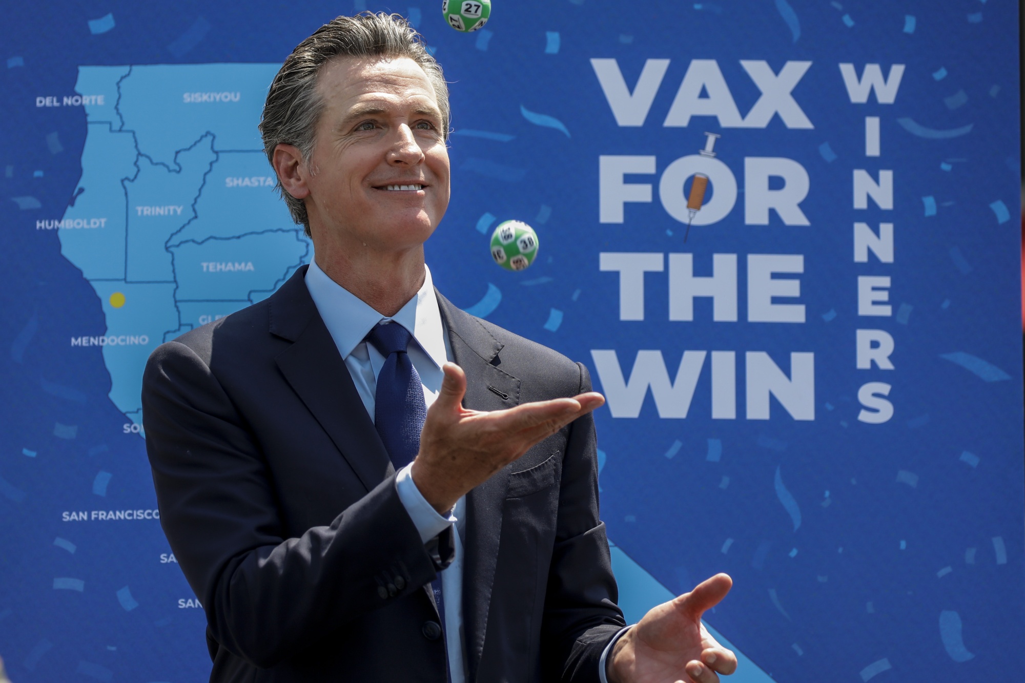 California Governor Gavin Newsom juggles numbered balls used in the state’s vaccine lottery&nbsp;in June 2021. Newsom drew 10 winners to receive $1.5 million each in&nbsp;the largest vaccine incentive program in the nation.&nbsp;
