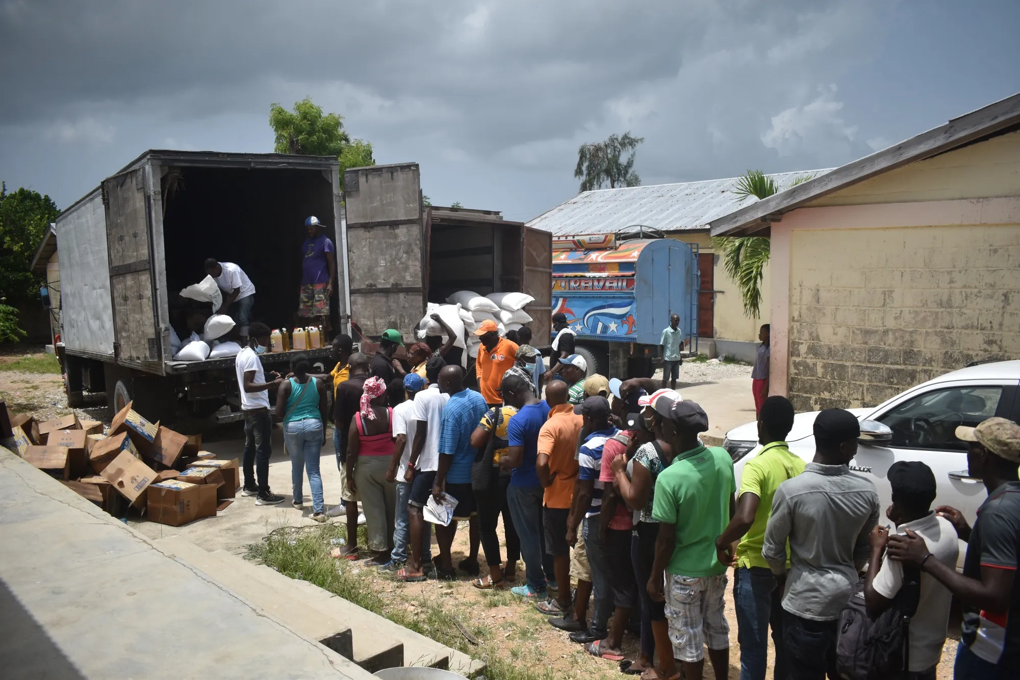 Residents wait in line to receive food aid in Port-Salut, Haiti.
