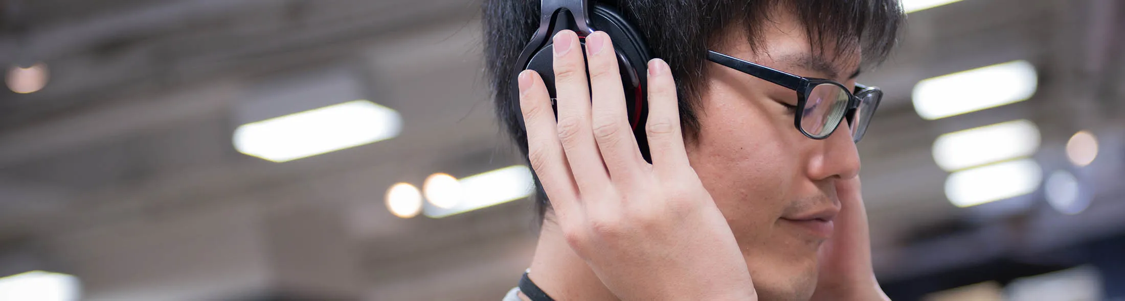 A member of staff listens to music as he plays a vinyl record at the HMV Record Shop operated by Lawson HMV Entertainment Inc. in the Shibuya district of Tokyo, Japan, on Wednesday, Sept. 28, 2016. Spotify Ltd. is bringing its popular online music service to Japan, a large and lucrative market where fans have demonstrated a continuing fondness for CDs and even vinyl records.
