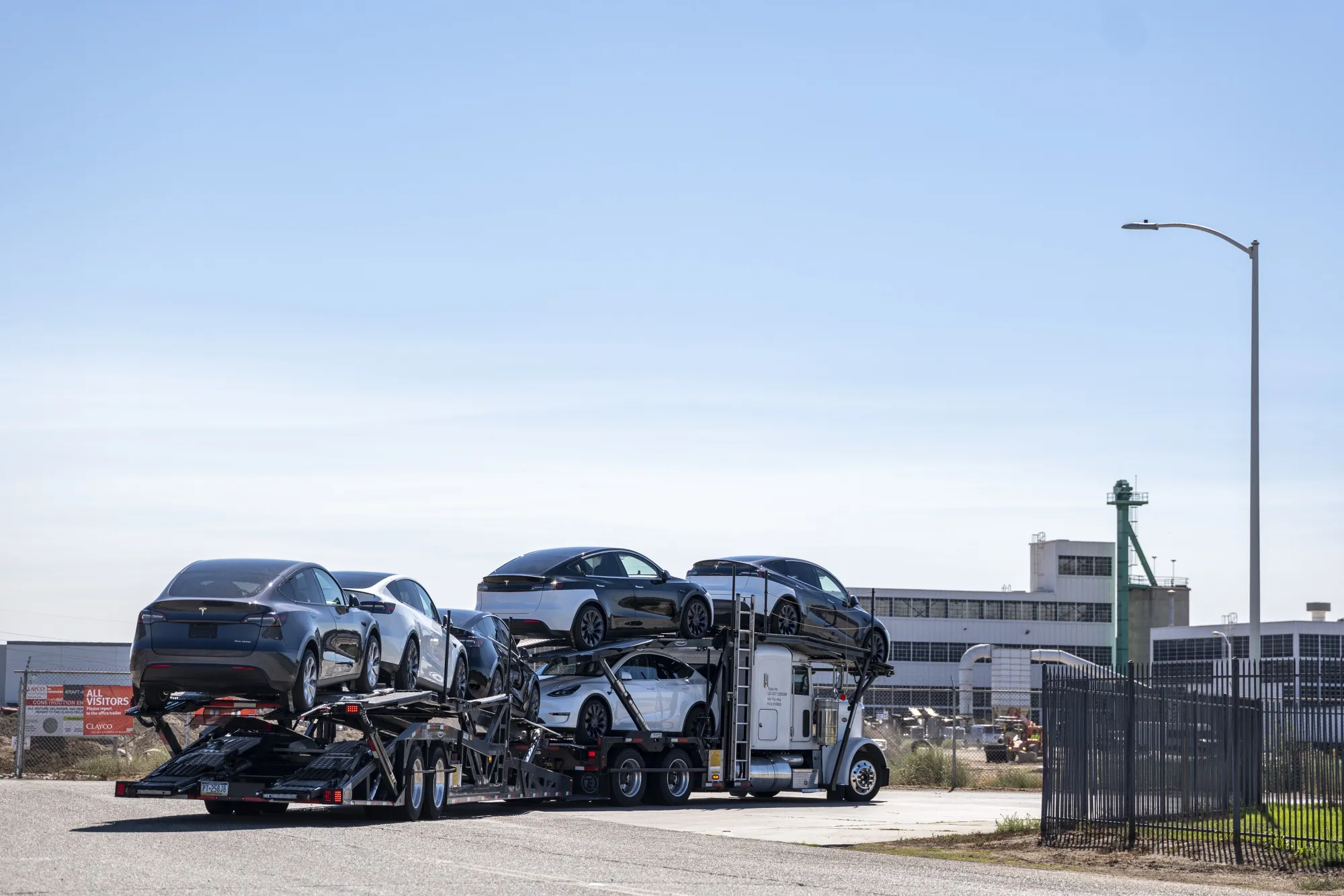 An auto carrier transports Tesla vehicles in Lathrop, California, on&nbsp;Sept. 27.
