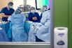 A student and staff watch over a donor d