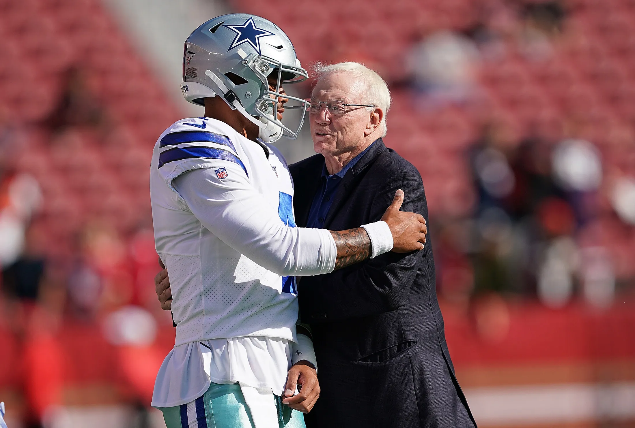 Dak Prescott of the Dallas Cowboys, left, and team owner Jerry Jones