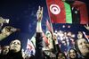 Libyans celebrate following the announcement of the liberation of the country in Martyr's Square,Tripoli, 2011.