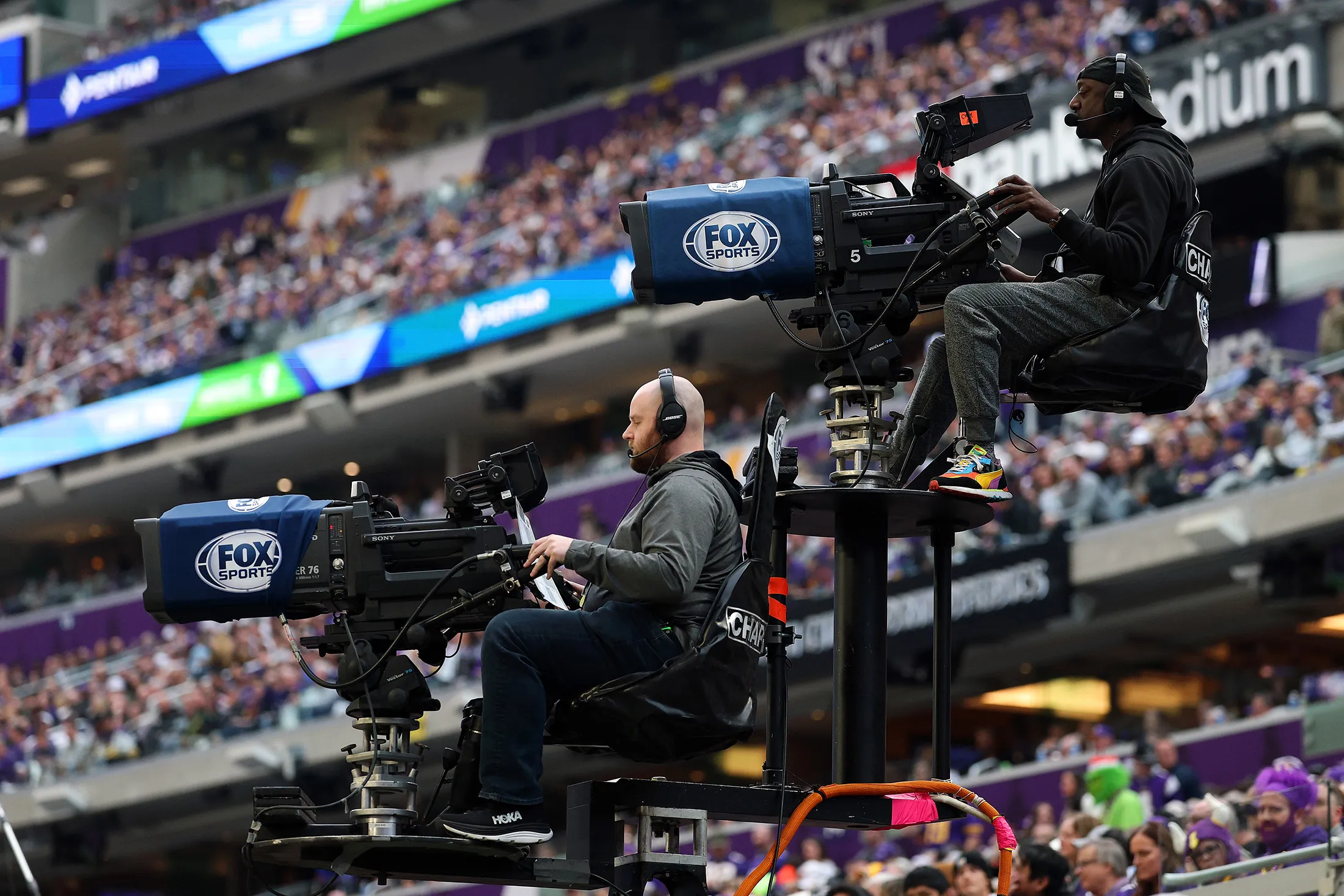 Fox Sports broadcast cameras on the sideline during a 2025 NFL game between the Washington Commanders and Minnesota Vikings at US&nbsp;Bank Stadium in Minneapolis, Minnesota, on Dec. 7, 2025.