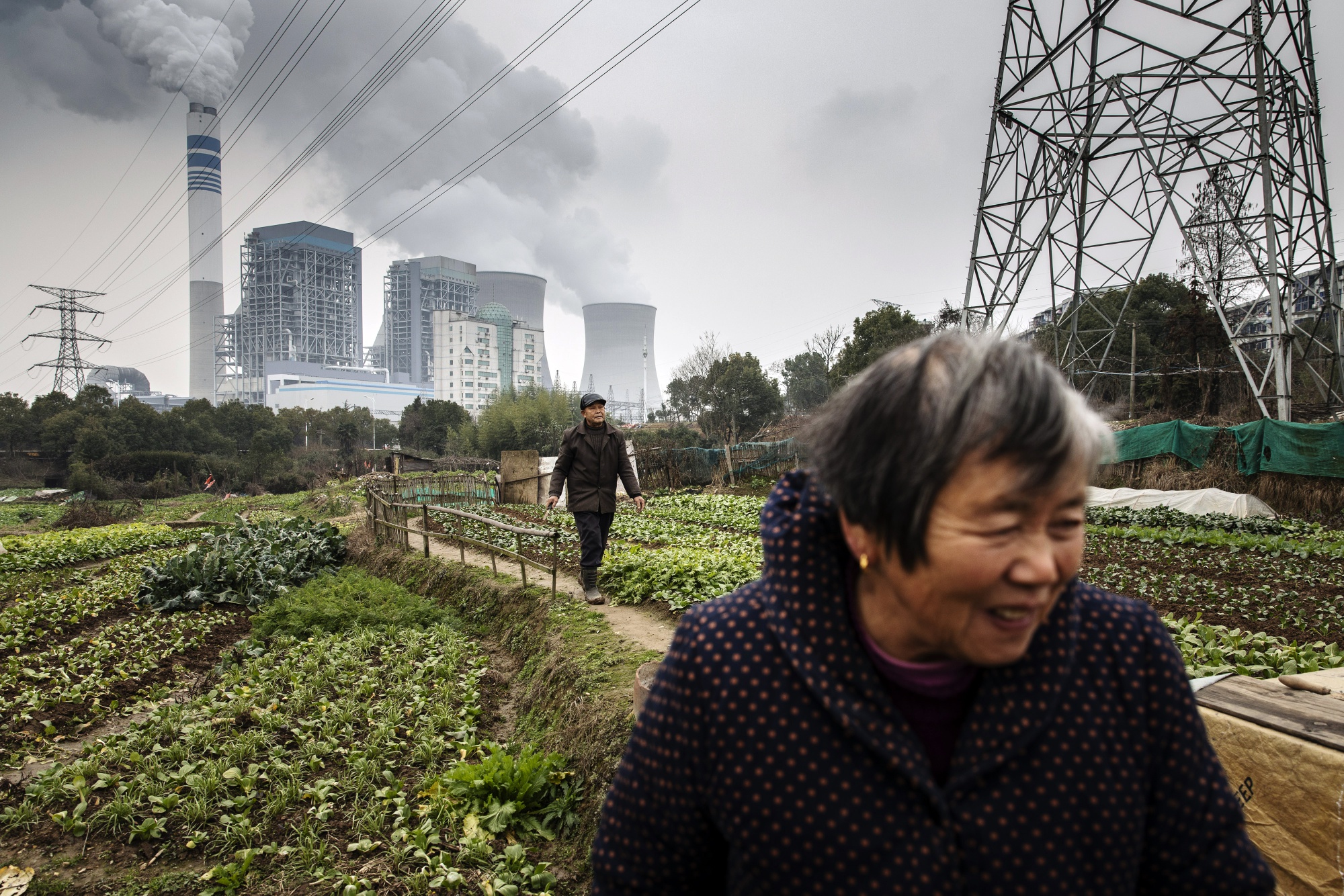 Emissions rise from cooling towers at a coal-fired power station in Tongling, Anhui province, China.