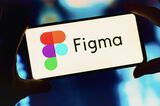 In this photo illustration, the Figma logo seen displayed on