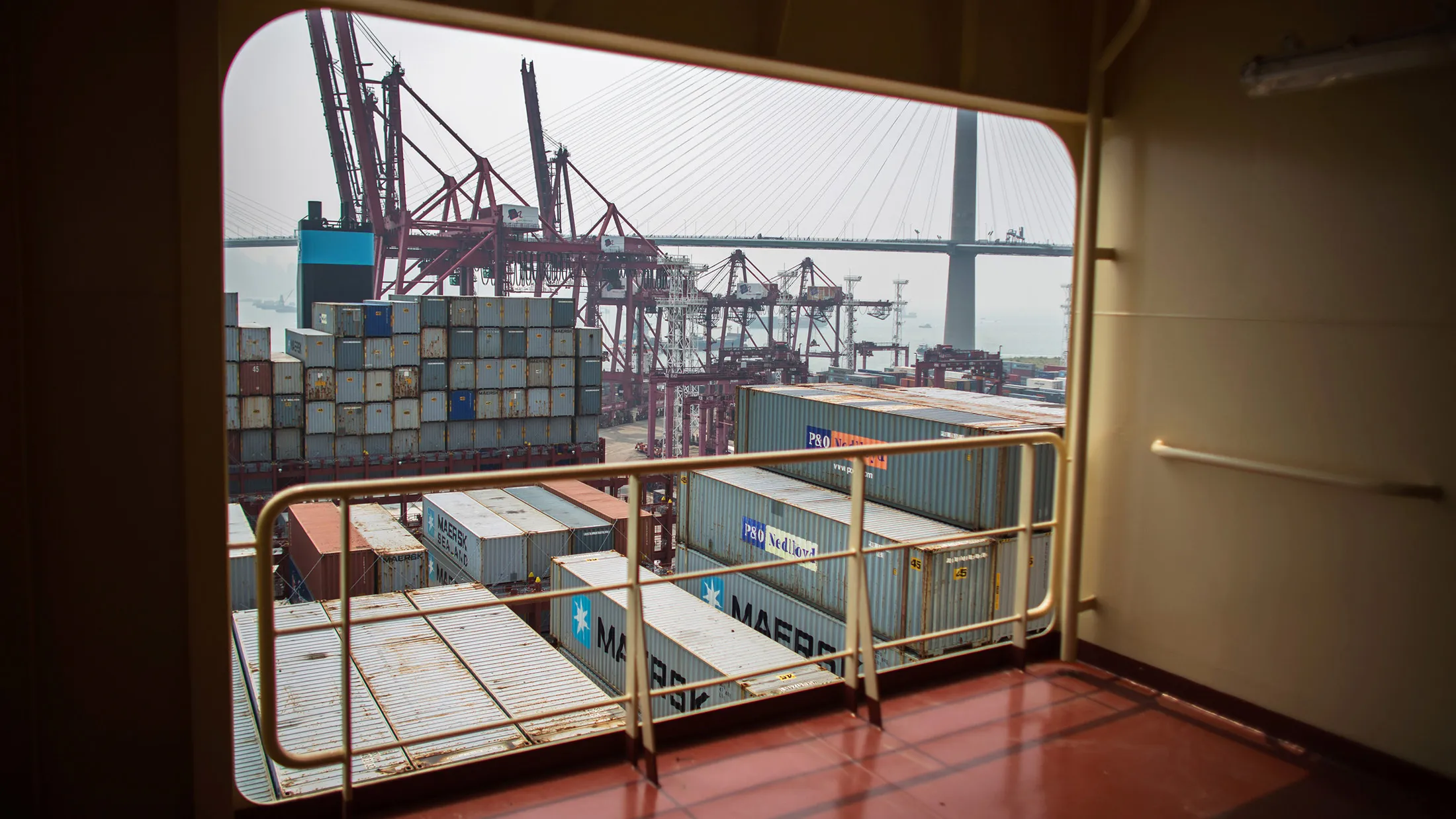 Shipping containers and cranes at the Modern Terminals container port in Hong Kong.
