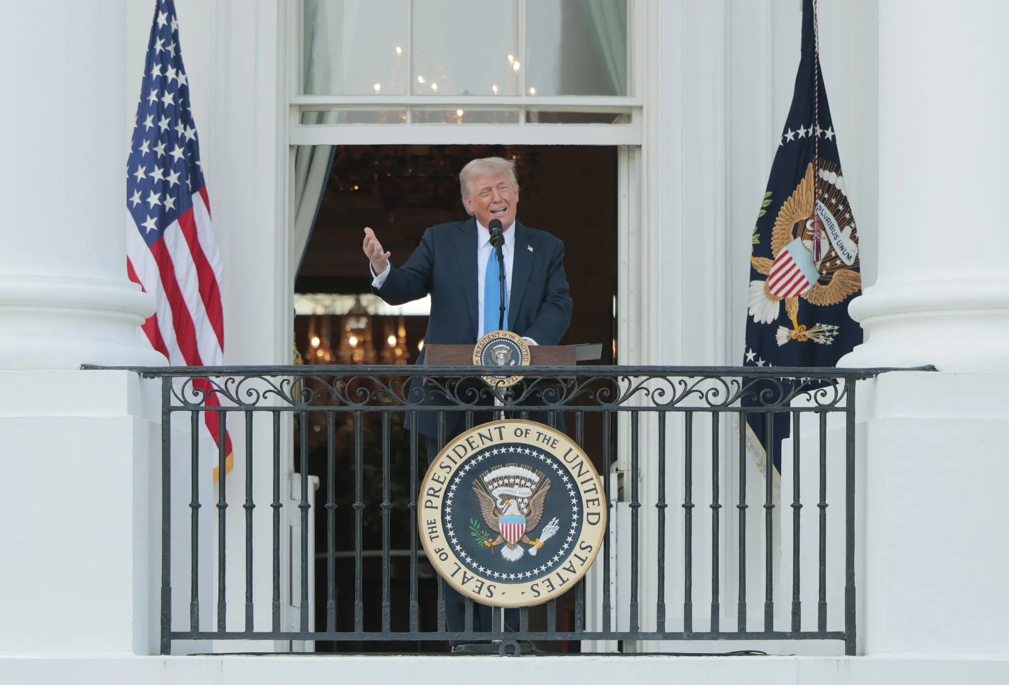 President Donald Trump speaks to guests from the South Portico of the White House&nbsp;in Washington.
