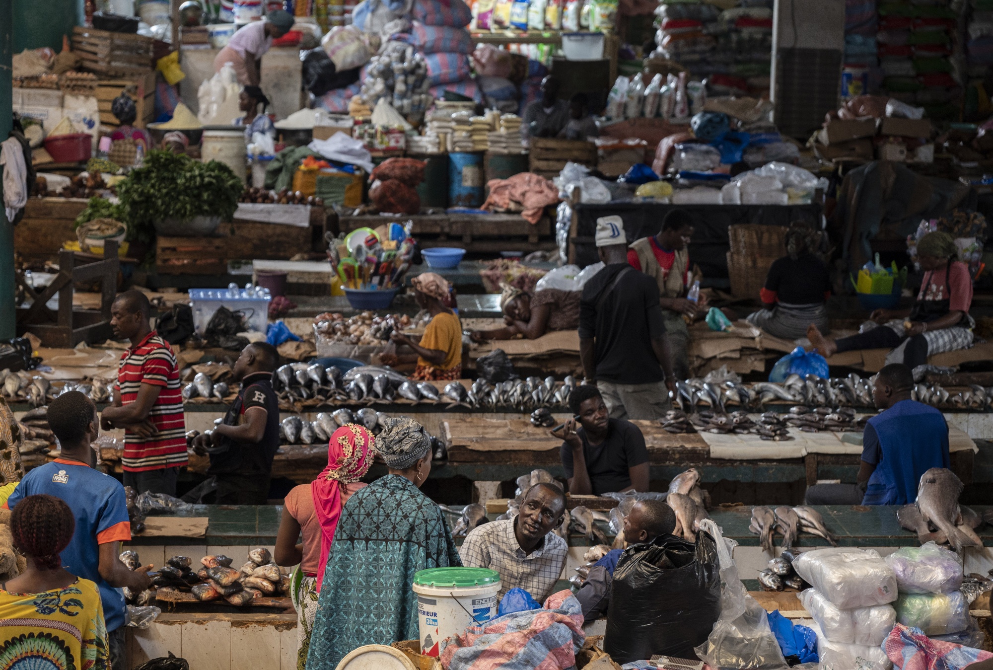 Vendors sell fresh food produce in the Adjame market in the Plateau district of Abidjan, Ivory Coast.