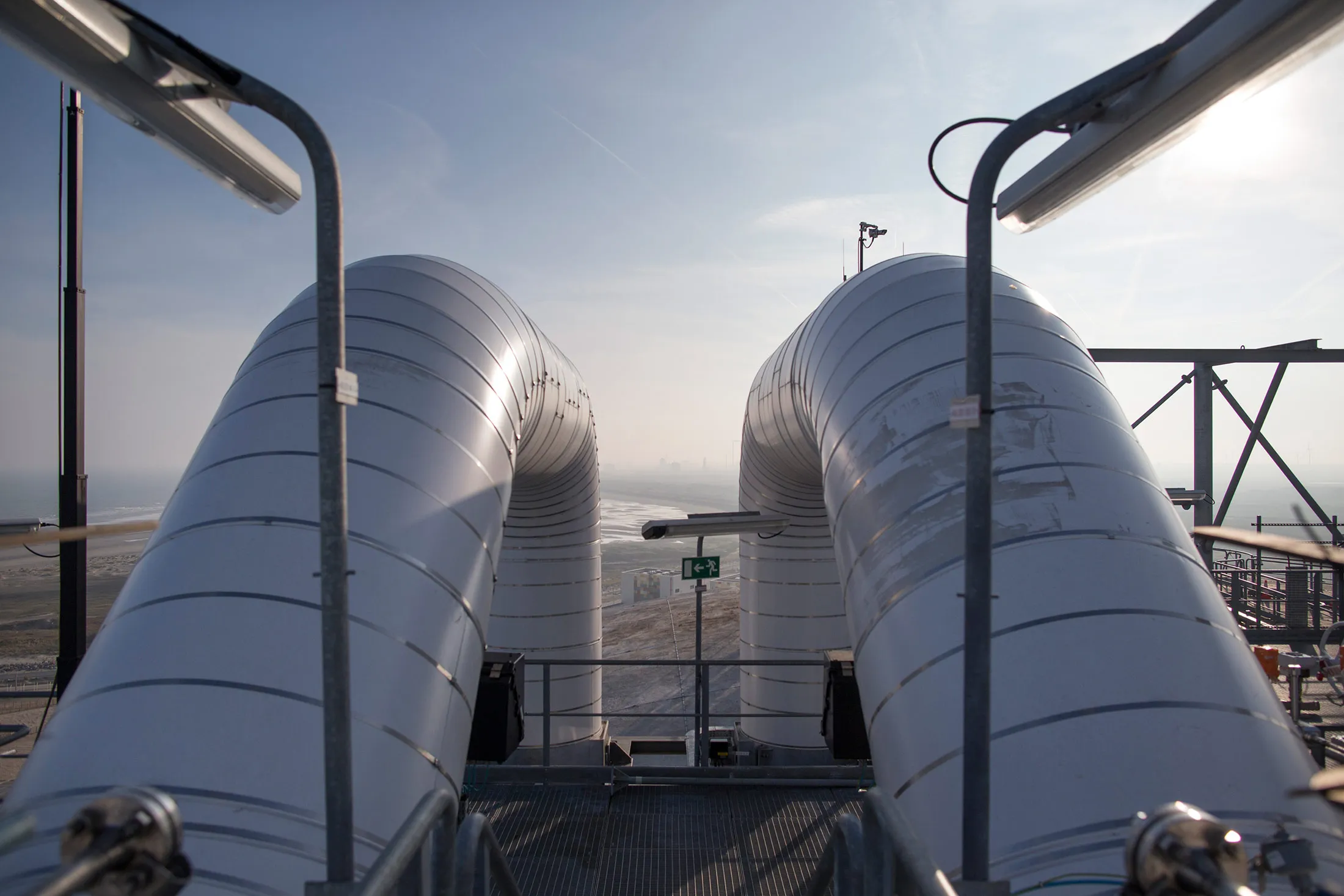 Pipework stands on top of a storage silo as construction work continues at the liquid natural gas (LNG) terminal, a unit of Electricite de France (EDF) SA, in Dunkirk, France, on Tuesday, March 15, 2016.&nbsp;