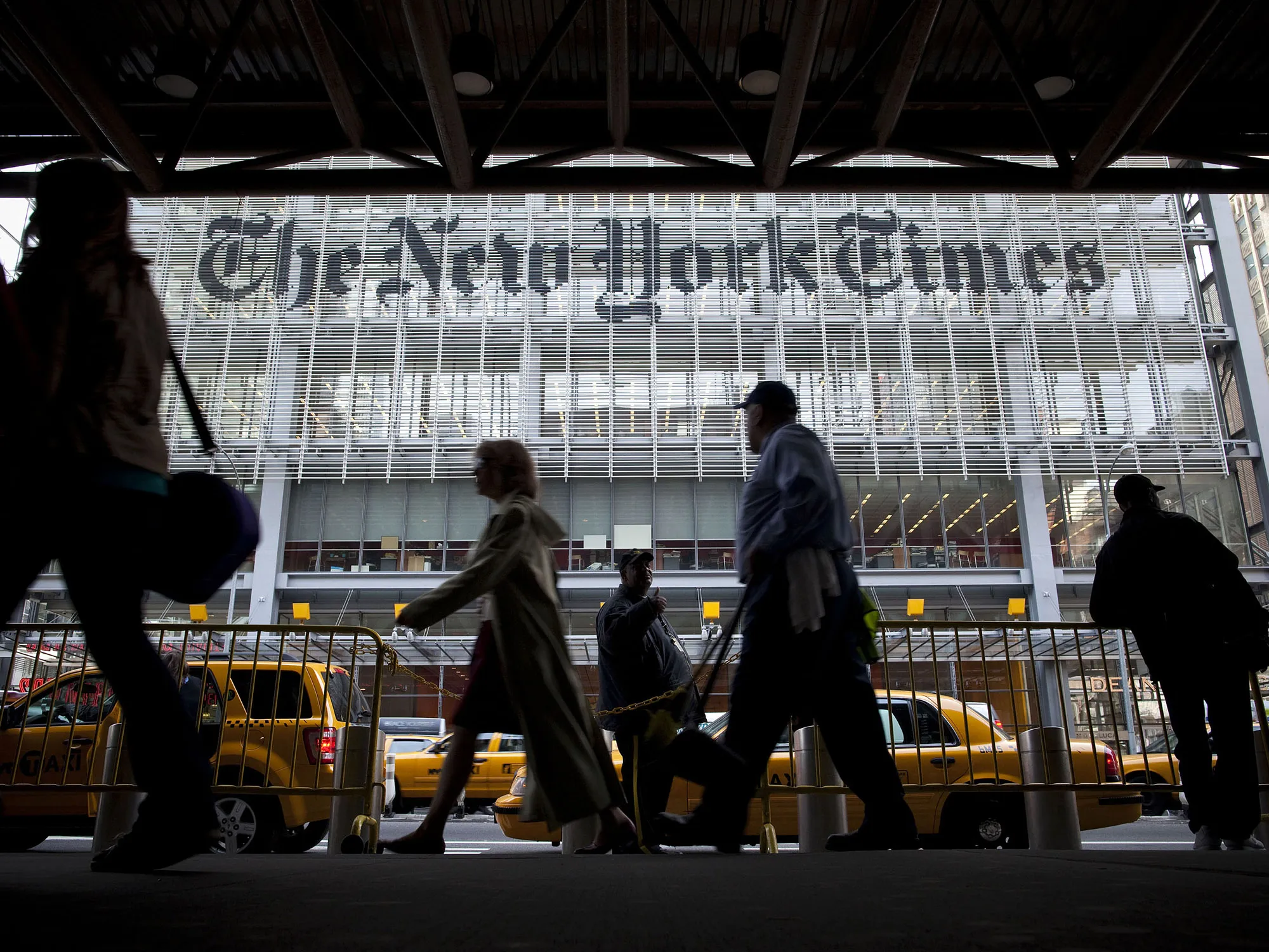 Pedestrians pass in front of the New York Times&nbsp;building in New York.