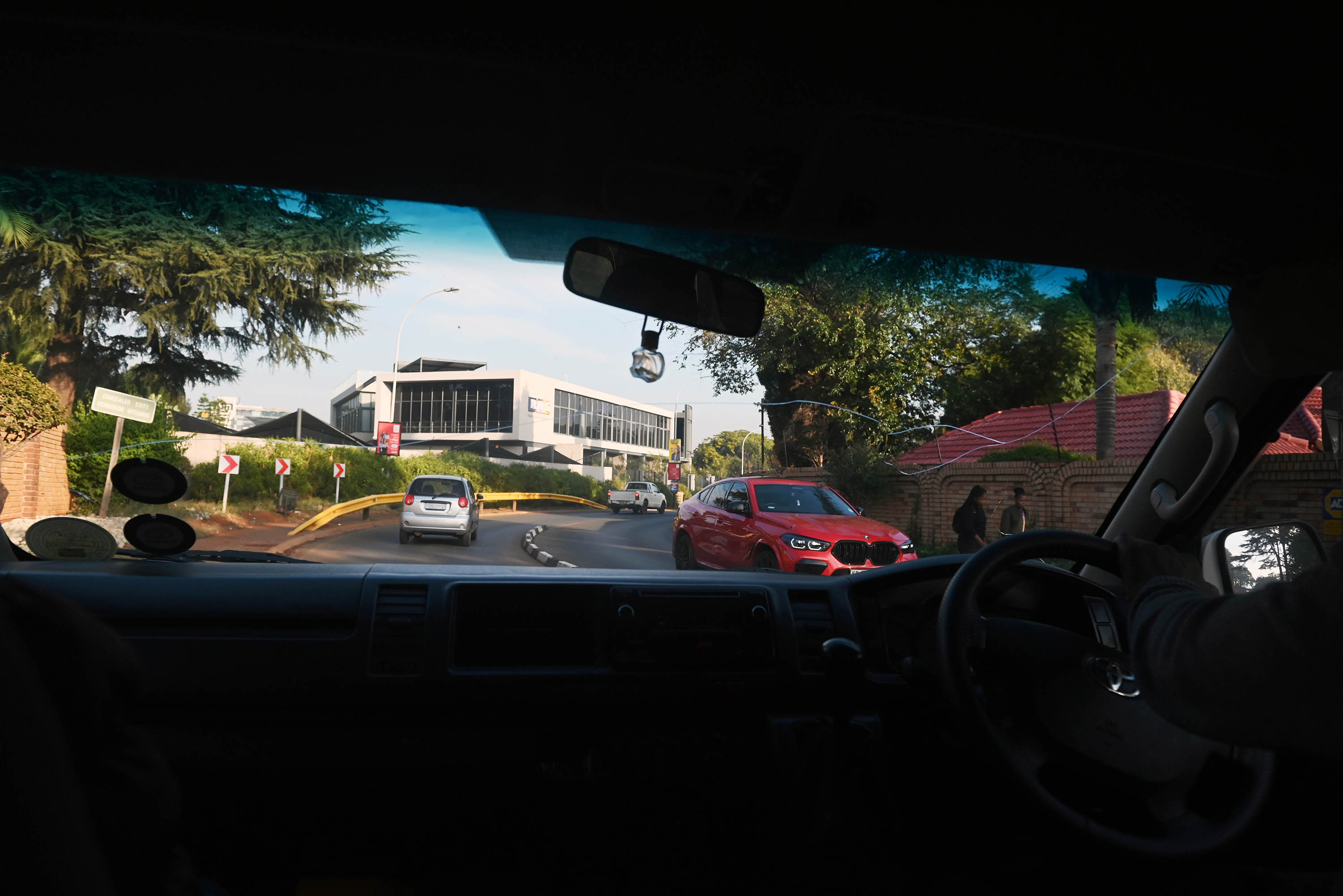 The Katlehong taxi passes through several suburban areas around Johannesburg before reaching the wealthy enclave of Bedfordview.