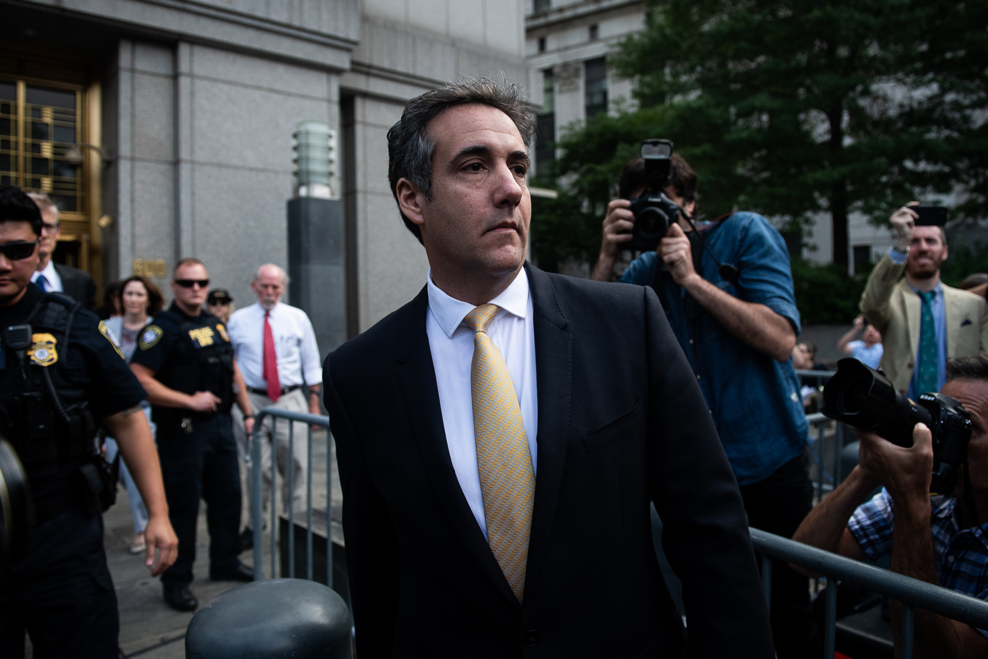 Michael Cohen exits from federal court in New York on Aug. 21, 2018.