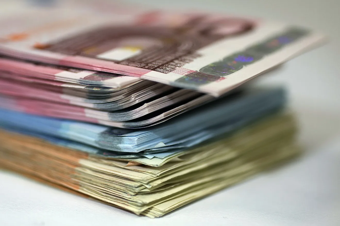 A stack of 50, 20 and 10 euro notes is arranged for a photograph inside a Travelex store, operated by Travelex Holdings Ltd., in London, U.K., on Wednesday, March 6, 2013. The U.K. currency weakened against all except one of its 16 major counterparts as 11 of the 39 economists surveyed by Bloomberg News predict the central bank will tomorrow increase its asset-purchase target to at least 400 billion pounds ($603 billion) from the current 375 billion pounds.