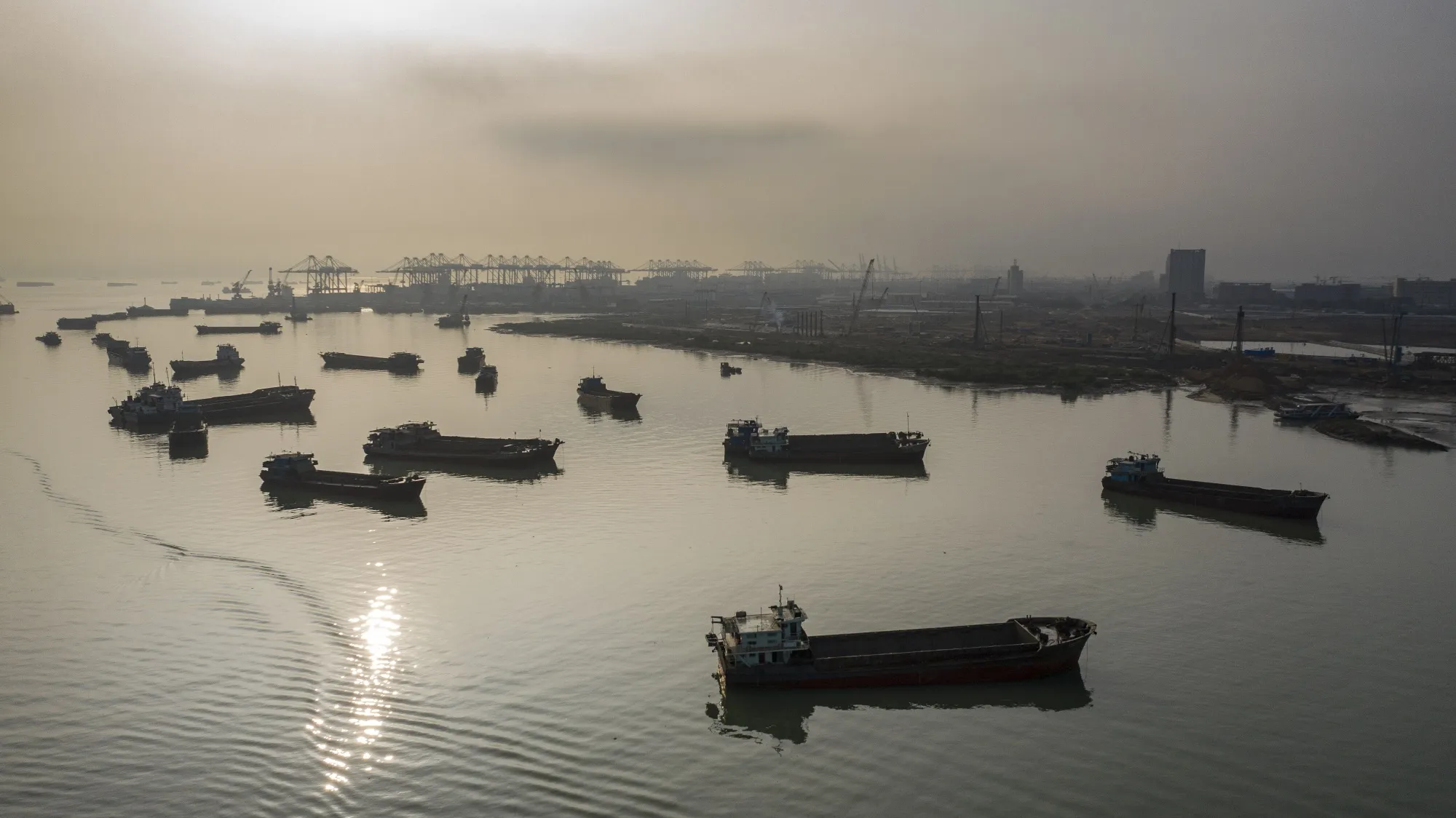 Barges are moored near the Port of Nansha in the Nansha district of Guangzhou, China.