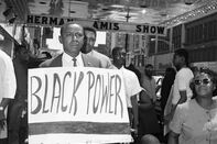 Floyd McKissick Holding Black Power Sign