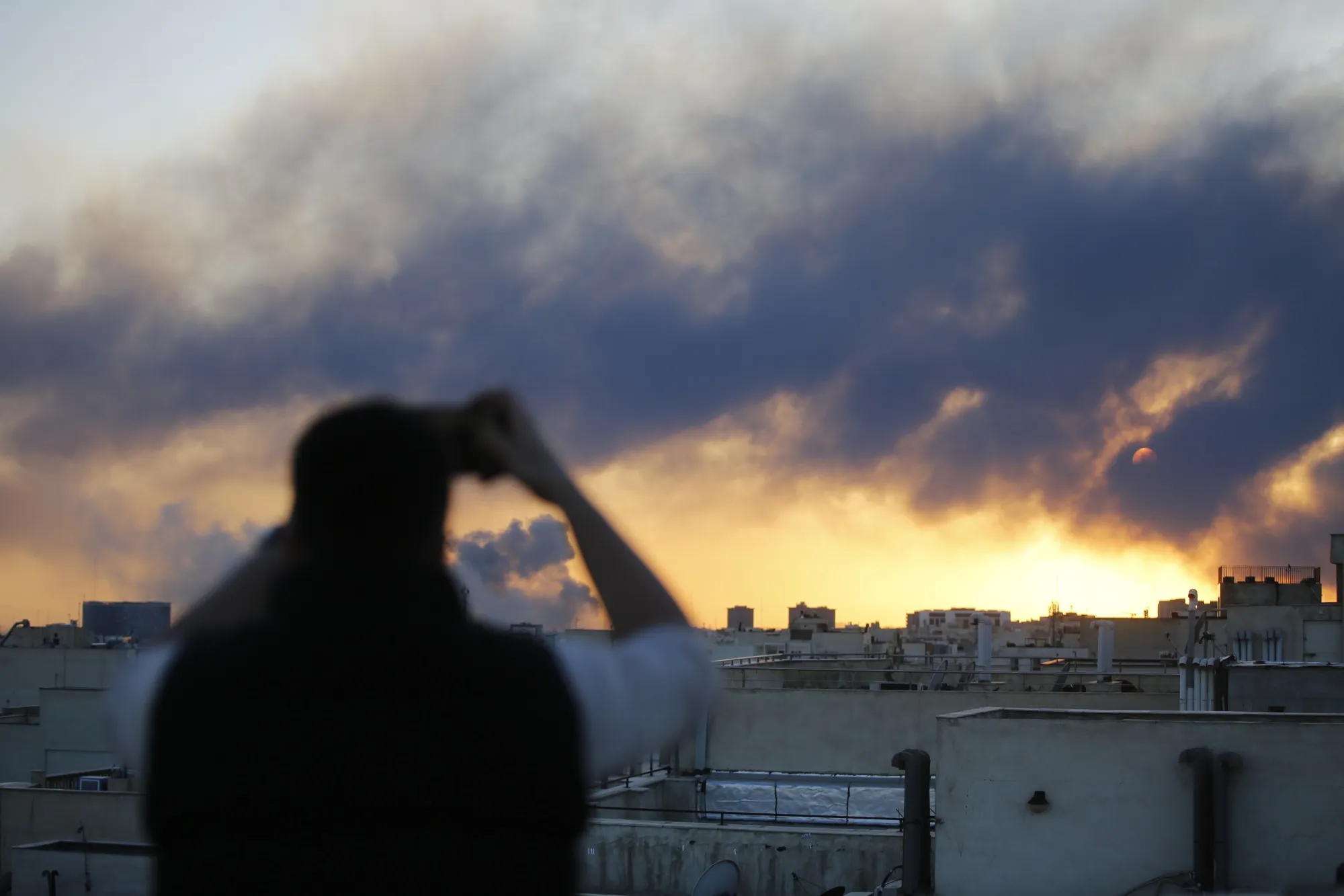Thick smoke rises over western areas of Tehran on March 3.