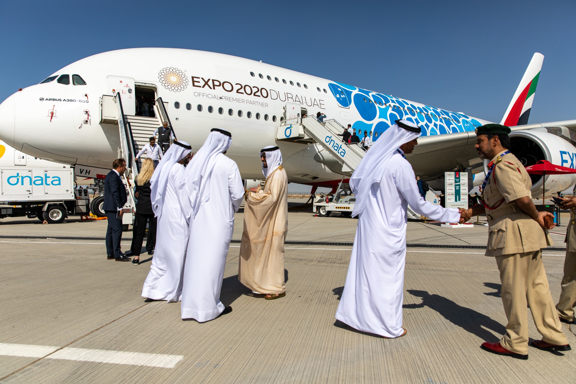 Attendees talk in front of an Airbus&nbsp;A380-800 aircraft during the 16th Dubai Air Show&nbsp;on Nov. 17.