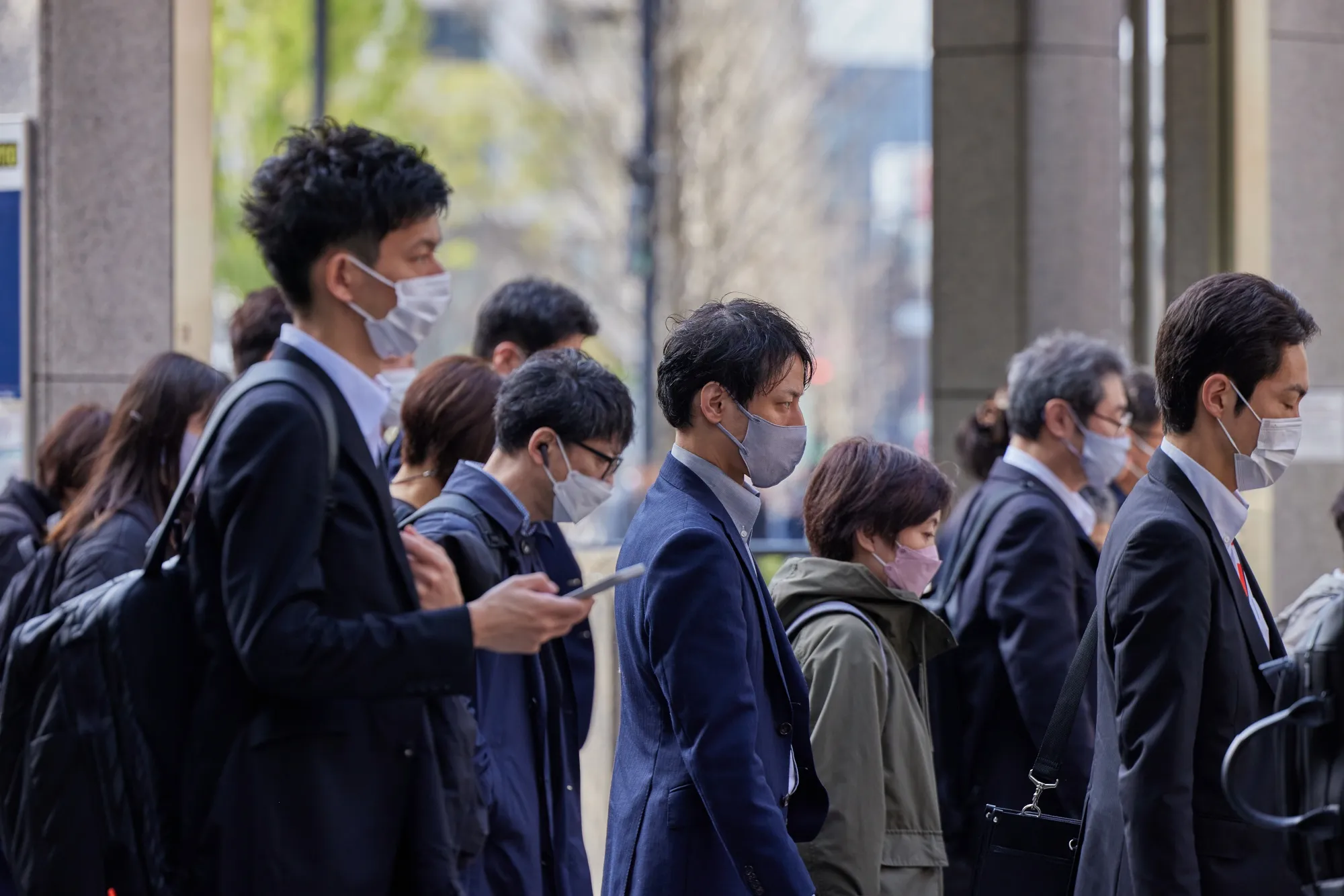 Morning commuters exit Tokyo Station.