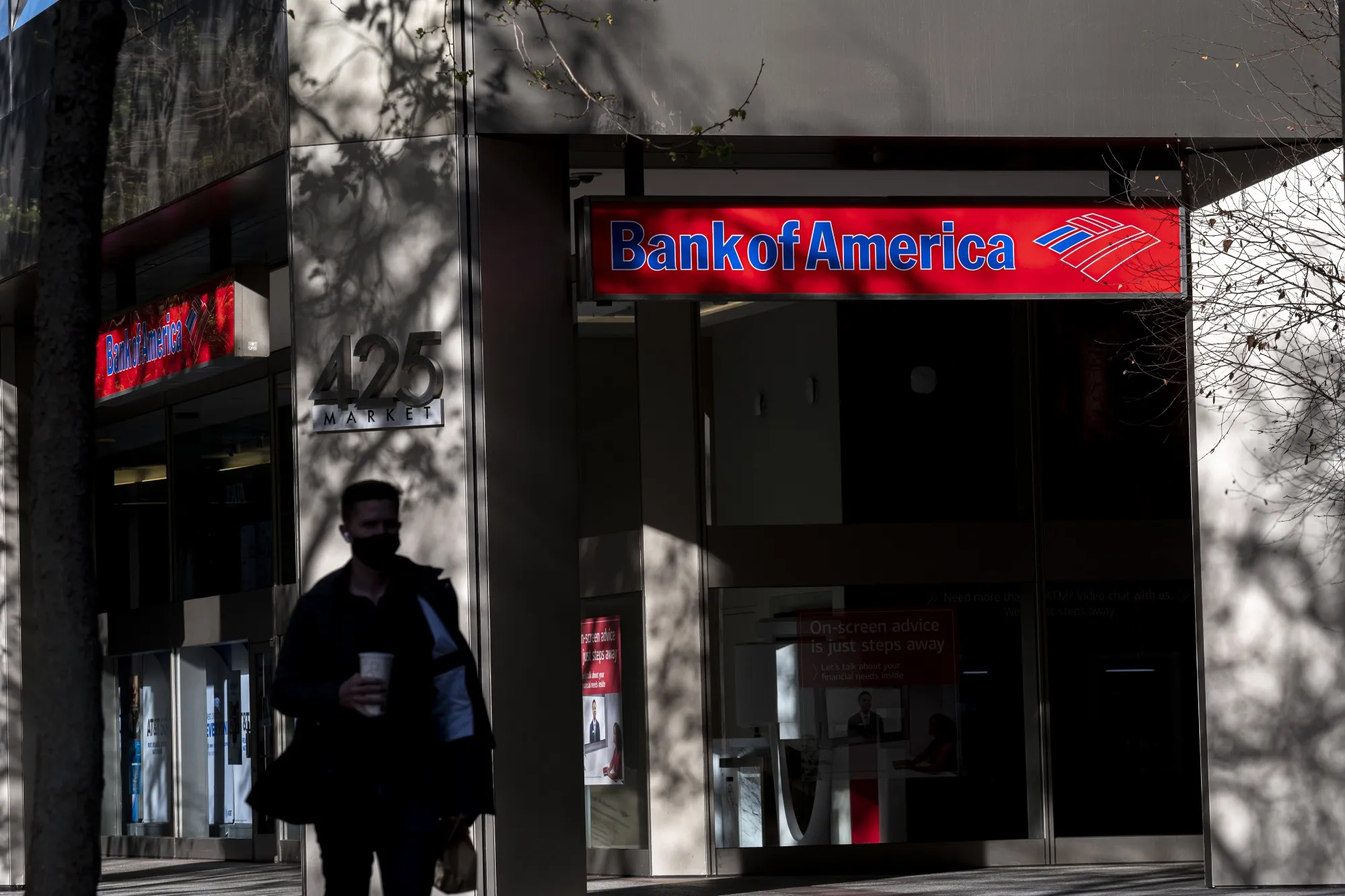 A pedestrian walks past a Bank of America bank branch in San Francisco, California.