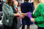 A recruiter shakes hands with a jobseeker at the Appalachian State University internship and job fair in Boone, North Carolina, US, on Friday, Oct. 24, 2025. Applications for US unemployment benefits rose last week, according to analyses of unadjusted state-level filings released during the federal government shutdown.