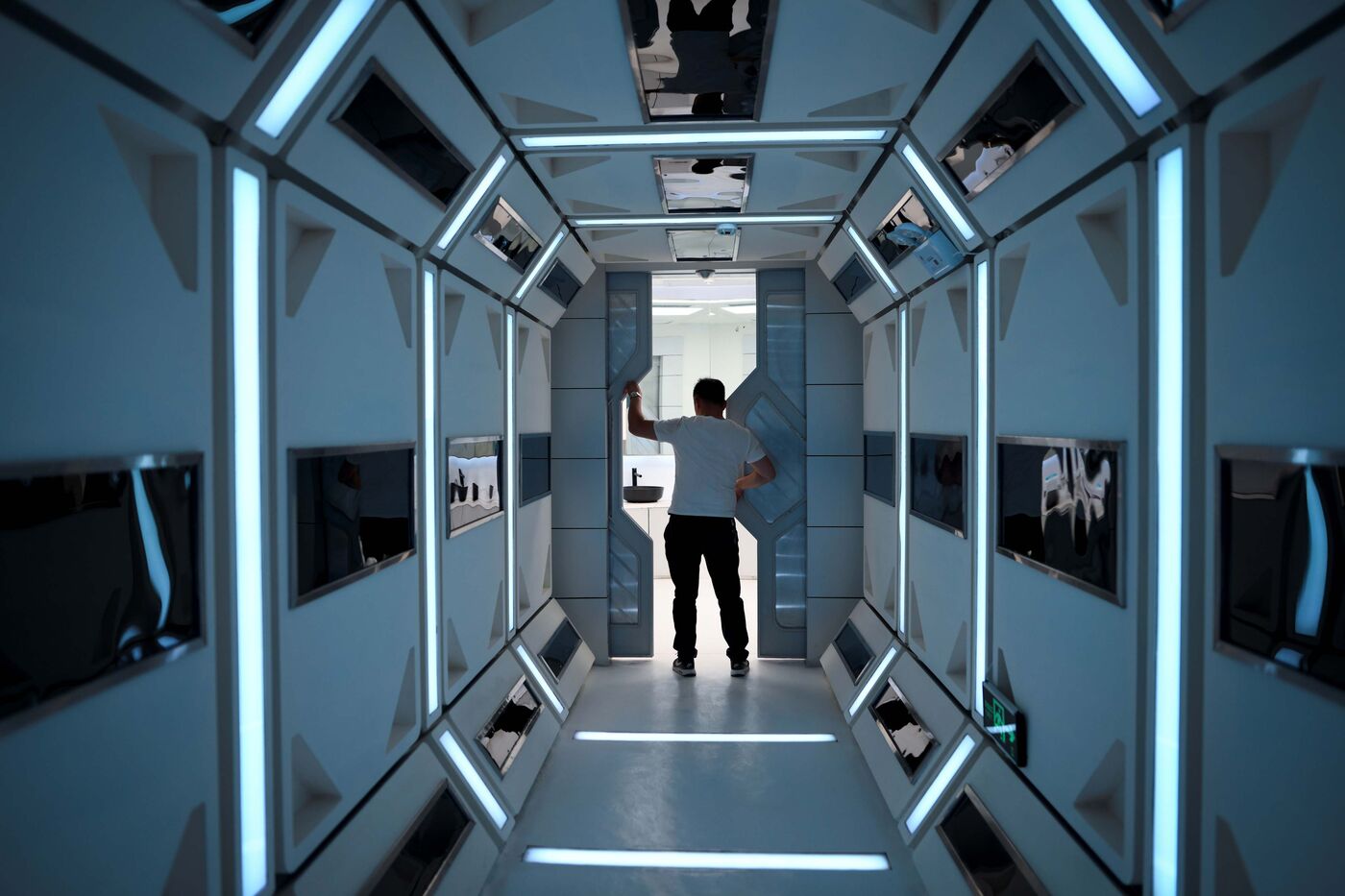 A man walks down a corridor inside Mars Base 1.