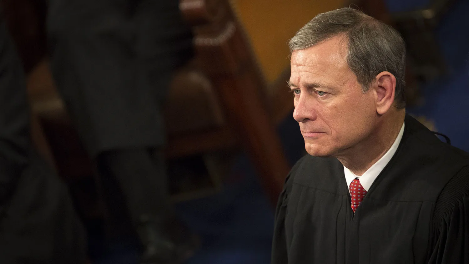Chief Supreme Court Justice John Roberts listens as President Barack Obama speaks at the Capitol in Washington on Jan. 12, 2016.
