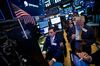 Traders work on the floor of the New York Stock Exchange (NYSE) in New York, U.S., on Monday, June 11, 2018.