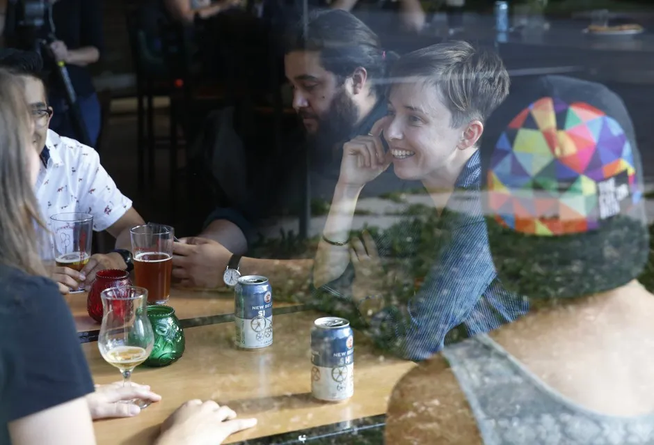 A group of friends catching up over drinks in Denver in 2016.