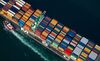 A tugboat helps guide a Mediterranean Shipping Co. (MSC) ship loaded with freight containers in this aerial photograph approaching the Port of Long Beach in Long Beach, California, U.S., on Friday, Feb. 1, 2013. The U.S. Census Bureau is scheduled to release trade balance figures on Feb. 8.