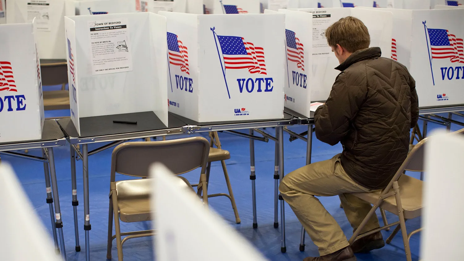 A man votes in the New Hampshire primary at Bedford High School on January 10, 2012 in Bedford, New Hampshire. Voters in New Hampshire headed to the polls in the nation's first primary election to pick their choice for a U.S. presidential candidate.
