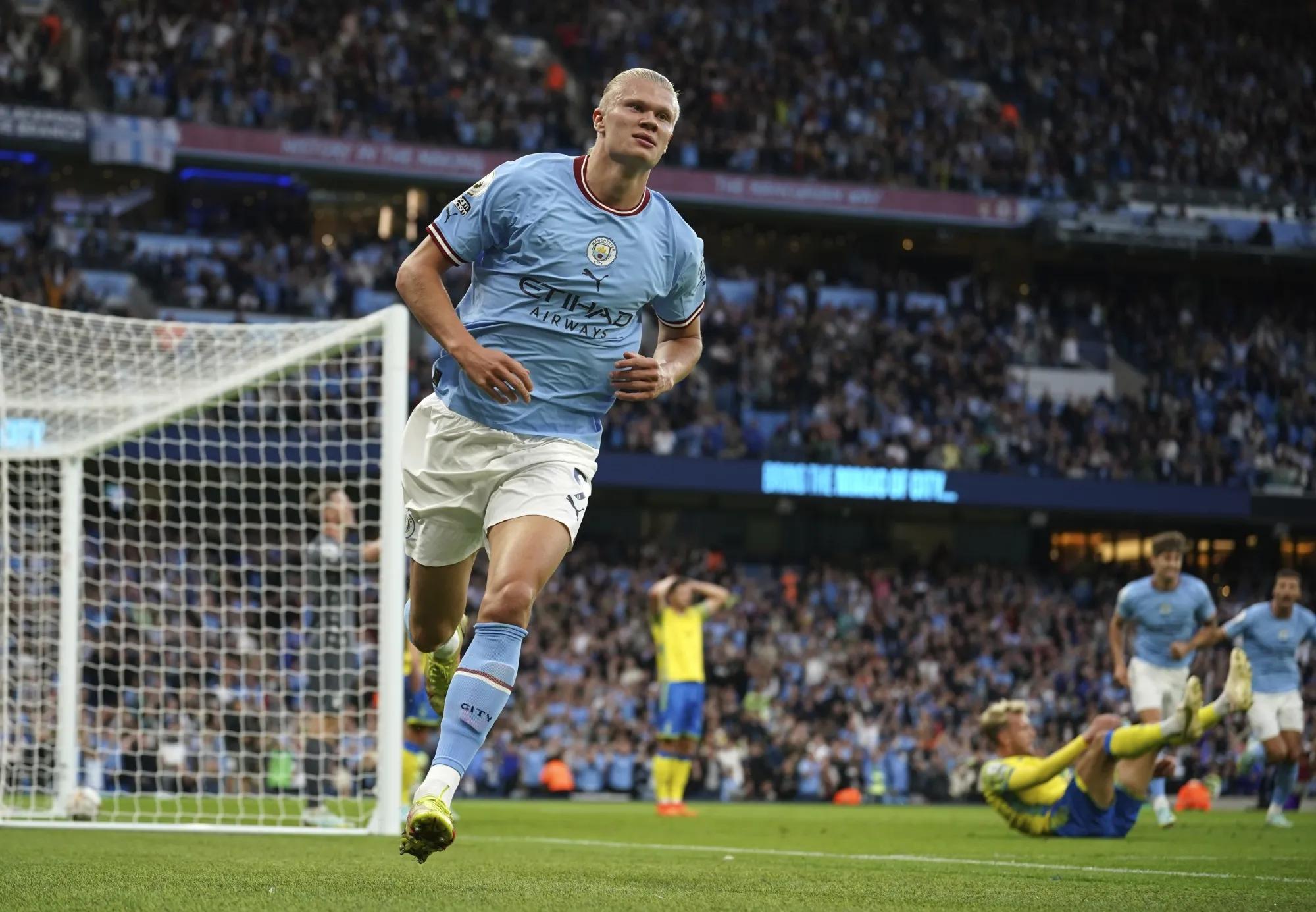 Manchester City's Erling Haaland celebrates after scoring his side's opening goal during the English Premier League soccer match between Manchester City and Nottingham Forest at Etihad Stadium in Manchester, England, Wednesday, Aug 31, 2022. (AP Photo/Dave Thompson)