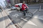 Cyclists ride on bike lanes on Bloor Street in Toronto, Canada, in 2017. Despite resistance from many local businesses, the bike lanes gave a boost to economic activity in the area. 