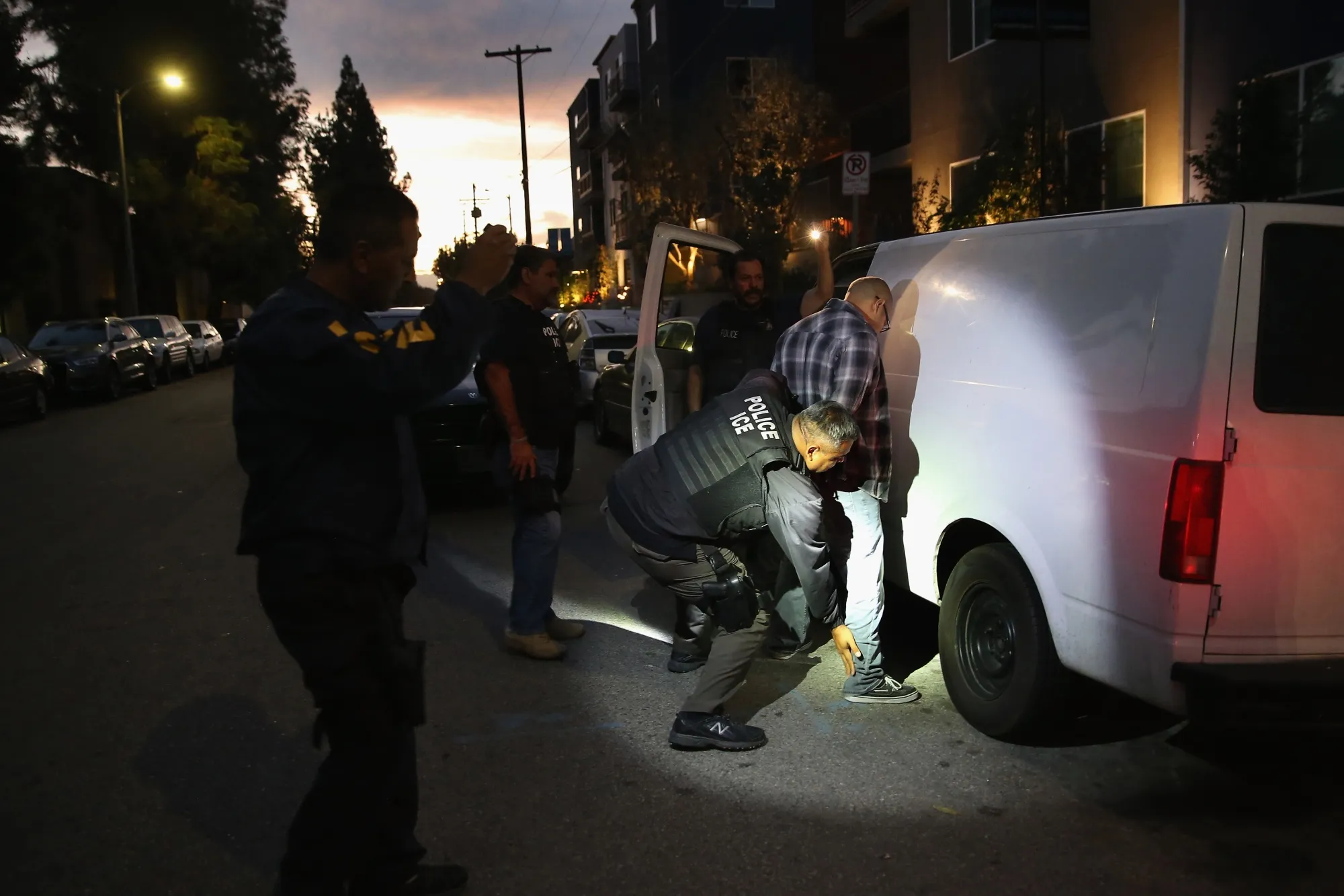 
A man is detained by Immigration and Customs Enforcement agents in Los Angeles.
