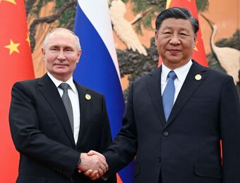 relates to Putin Visits Xi as US Threatens China Sanctions Over Ties