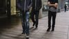 A group of men walks through a public space at Twitter Inc. headquarters.