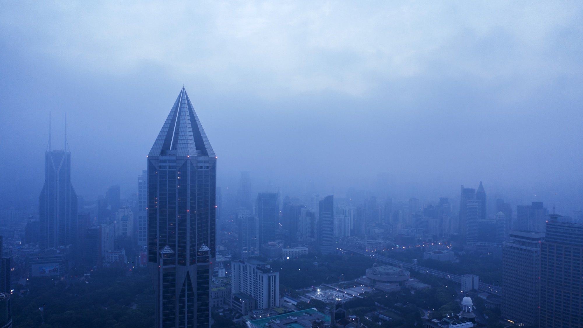Buildings stand at dawn in this aerial photograph taken in Shanghai in 2019.