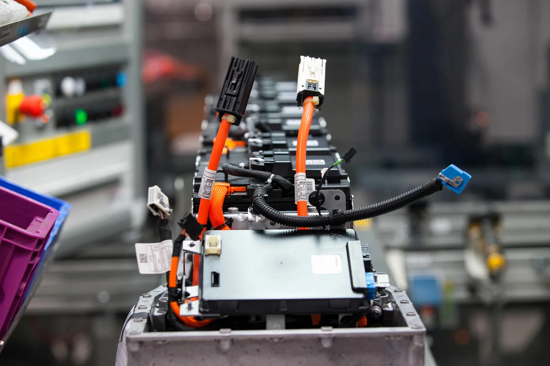 Cables and lithium-ion battery components on the production line at an automobile manufacturing plant in Dingolfing, Germany.