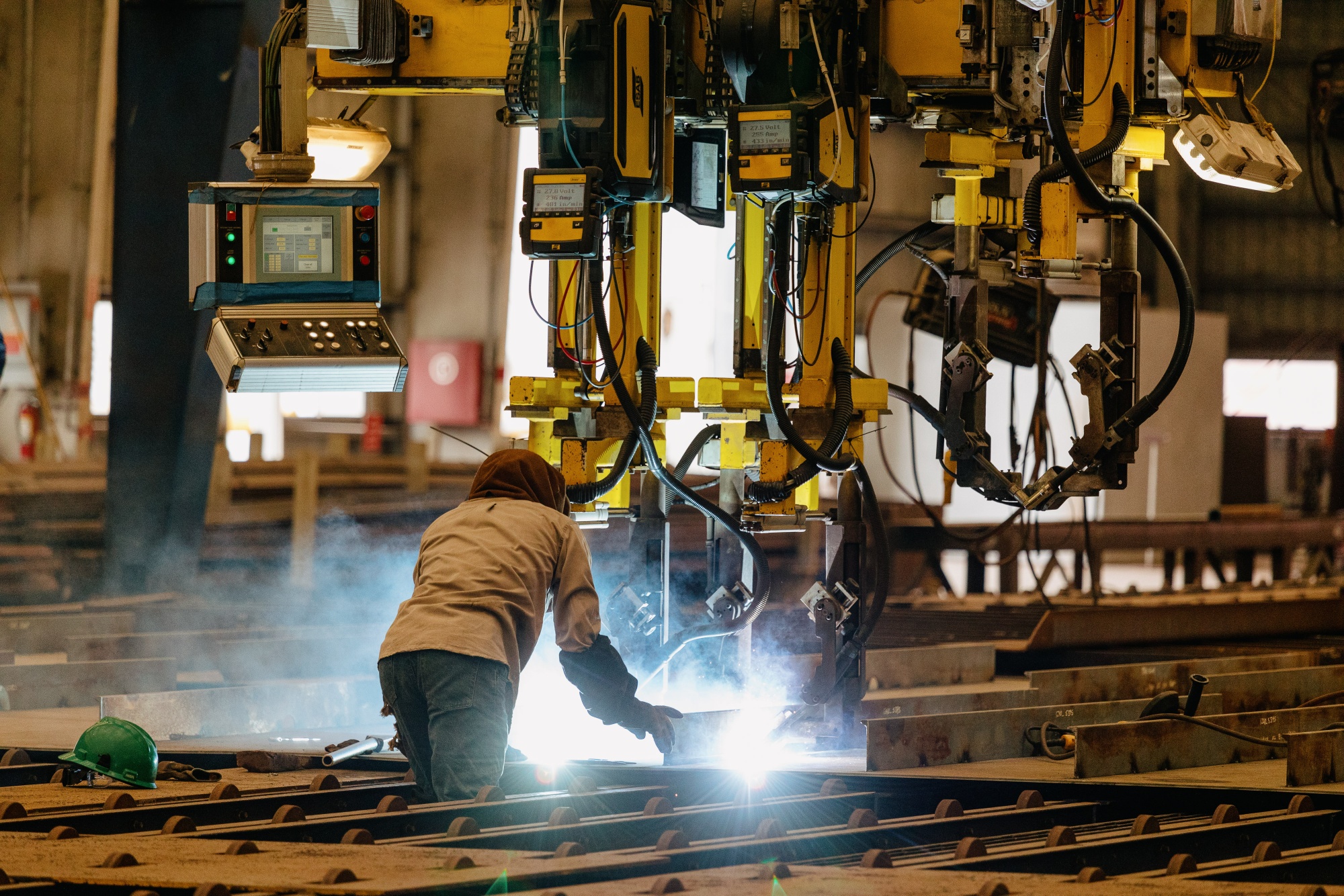 A worker welds steel for the construction of the 262-foot Eco Edison vessel at a shipyard in Houma, Louisiana.