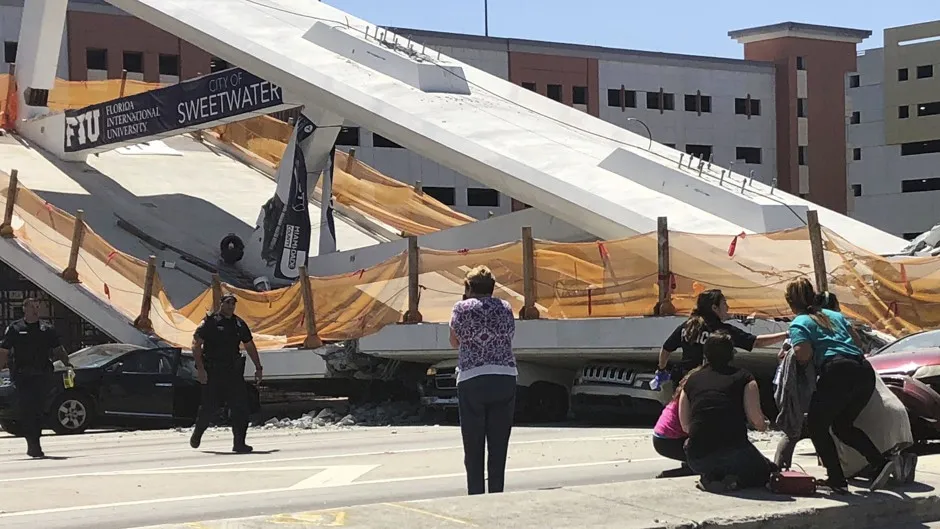A pedestrian bridge collapsed days after it was built over Southwest Eighth Street, allowing people to bypass the busy street to reach Florida International University.